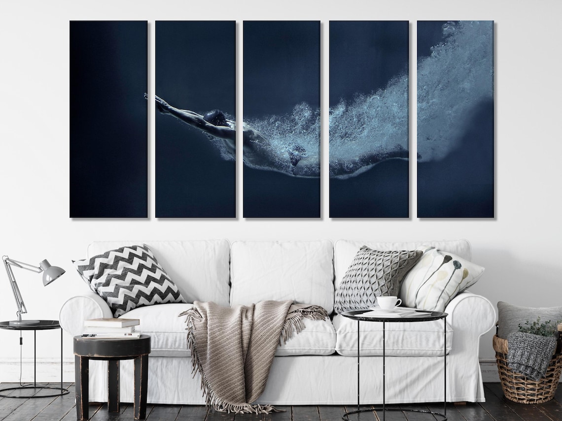 Underwater swimmer-like figure in a dark navy scene with foamy cyan-white splash detail view
