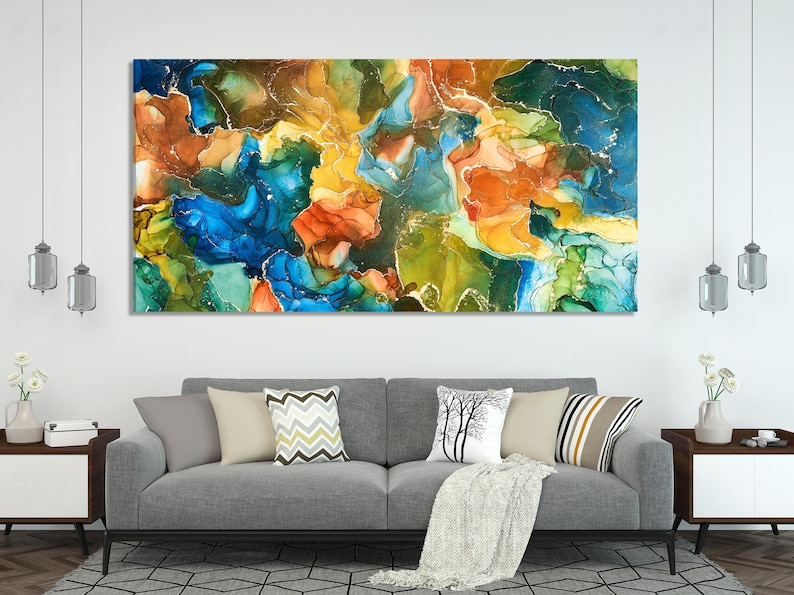Abstract ink-style artwork with marbled blue, teal, green, and warm orange swirls