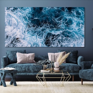 Modern ocean-themed artwork highlighting striking white foam and deep blue water currents, bringing a fresh nautical vibe to your home décor.