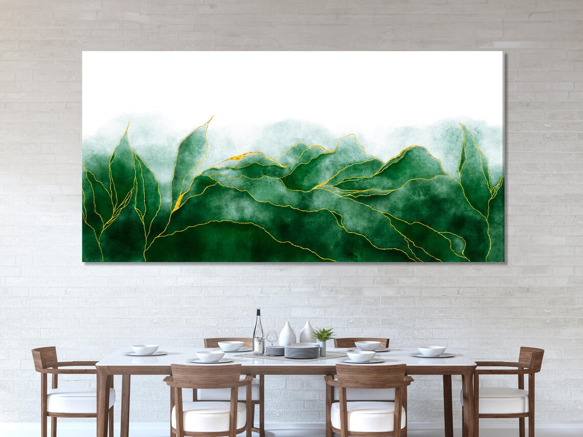 Abstract botanical artwork triptych above a sofa in a bright room