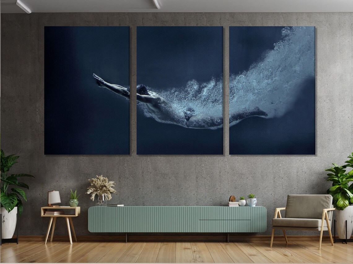 Underwater swimmer-like figure in a dark navy scene with foamy cyan-white splash detail view