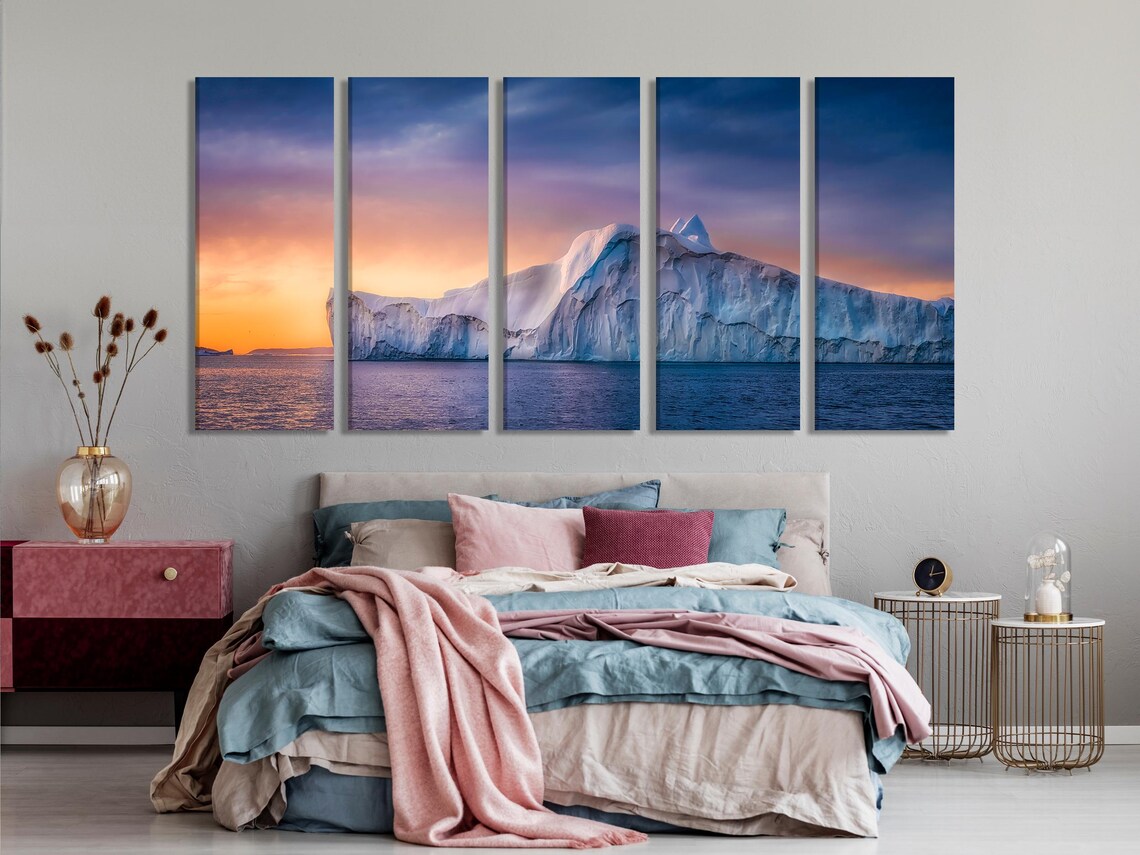 Room mockup showing a blue sofa with three panels of polar glacier artwork on the wall