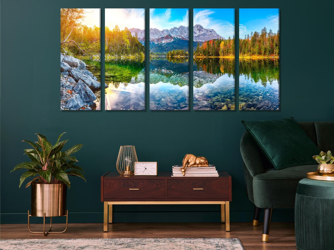 Room mockup showing a bedroom with a panoramic mountain lake landscape artwork above the bed