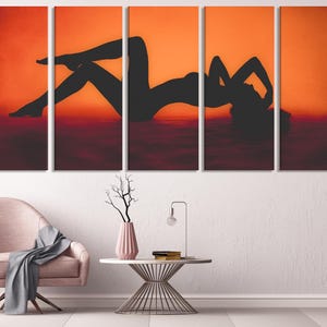 Five-panel canvas print depicting a silhouette of a person reclining against an orange background. The silhouette is dark and the background is a warm orange gradient. The image is a modern art piece suitable for home decor. The artwork is divided into five equal parts, creating a multi-panel effect.