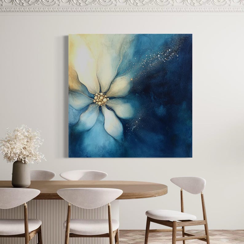 Abstract flower artwork with cool blue petals, soft ivory highlights and a warm gold bead-like centre