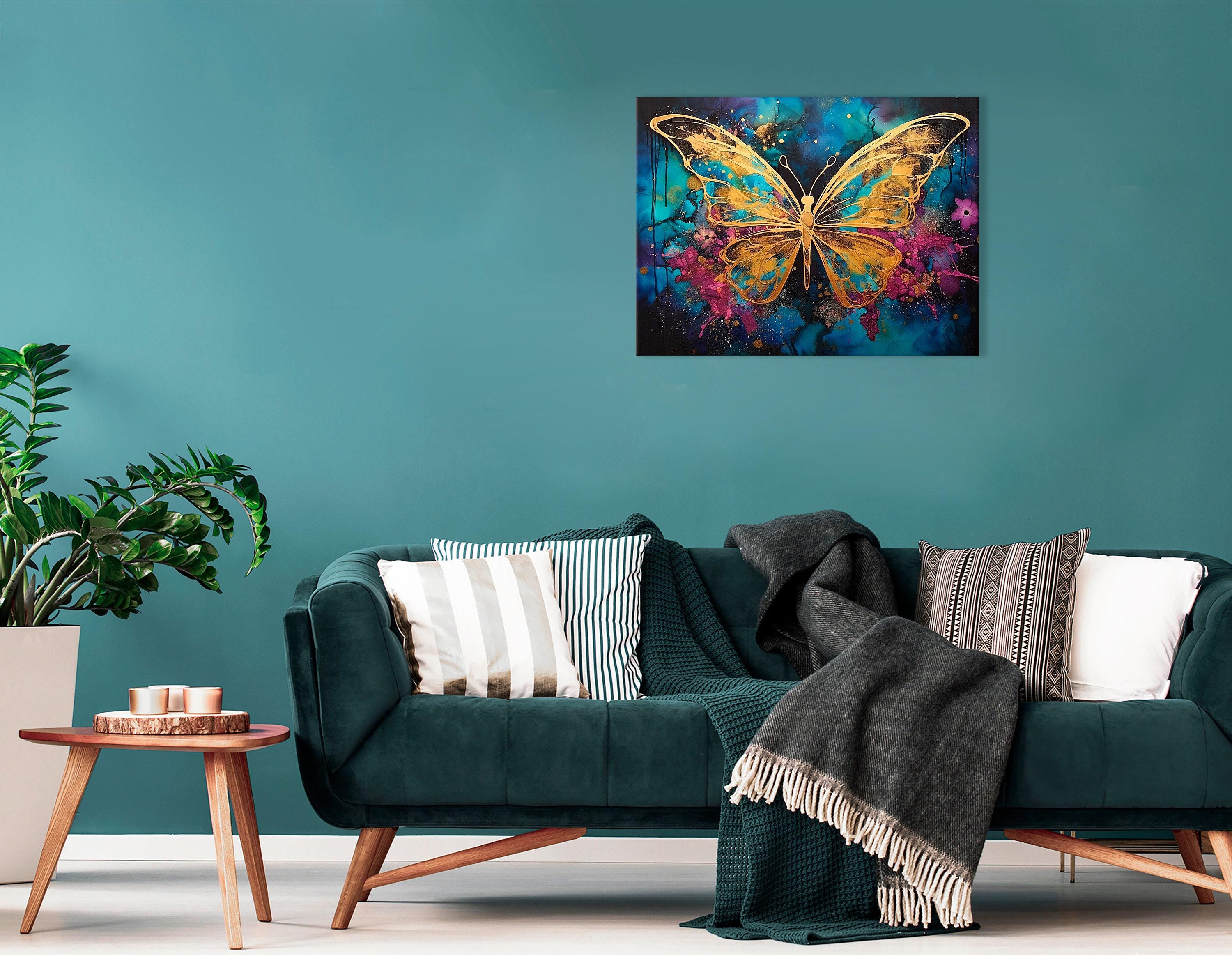 Abstract gold butterfly on a teal, blue and magenta splash background with glitter-like speckles detail view