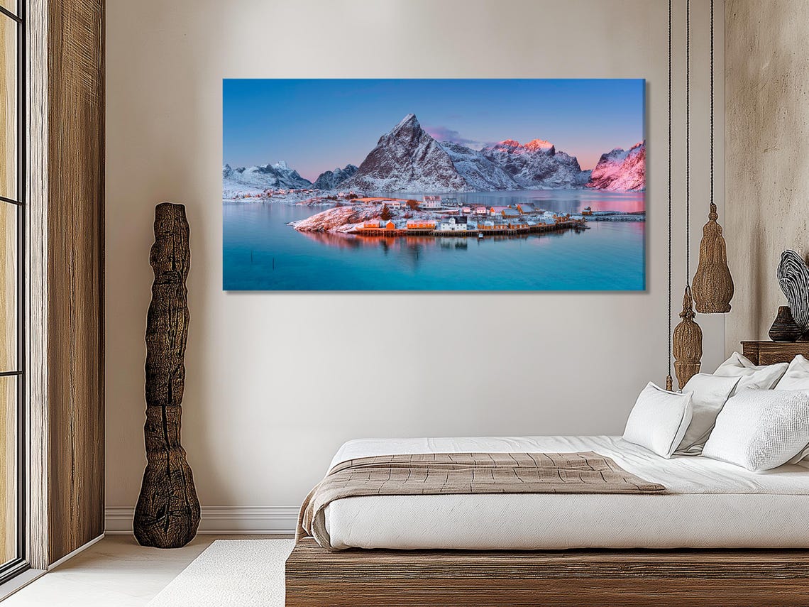 Triptych winter coastal artwork above a sofa in a modern room mockup