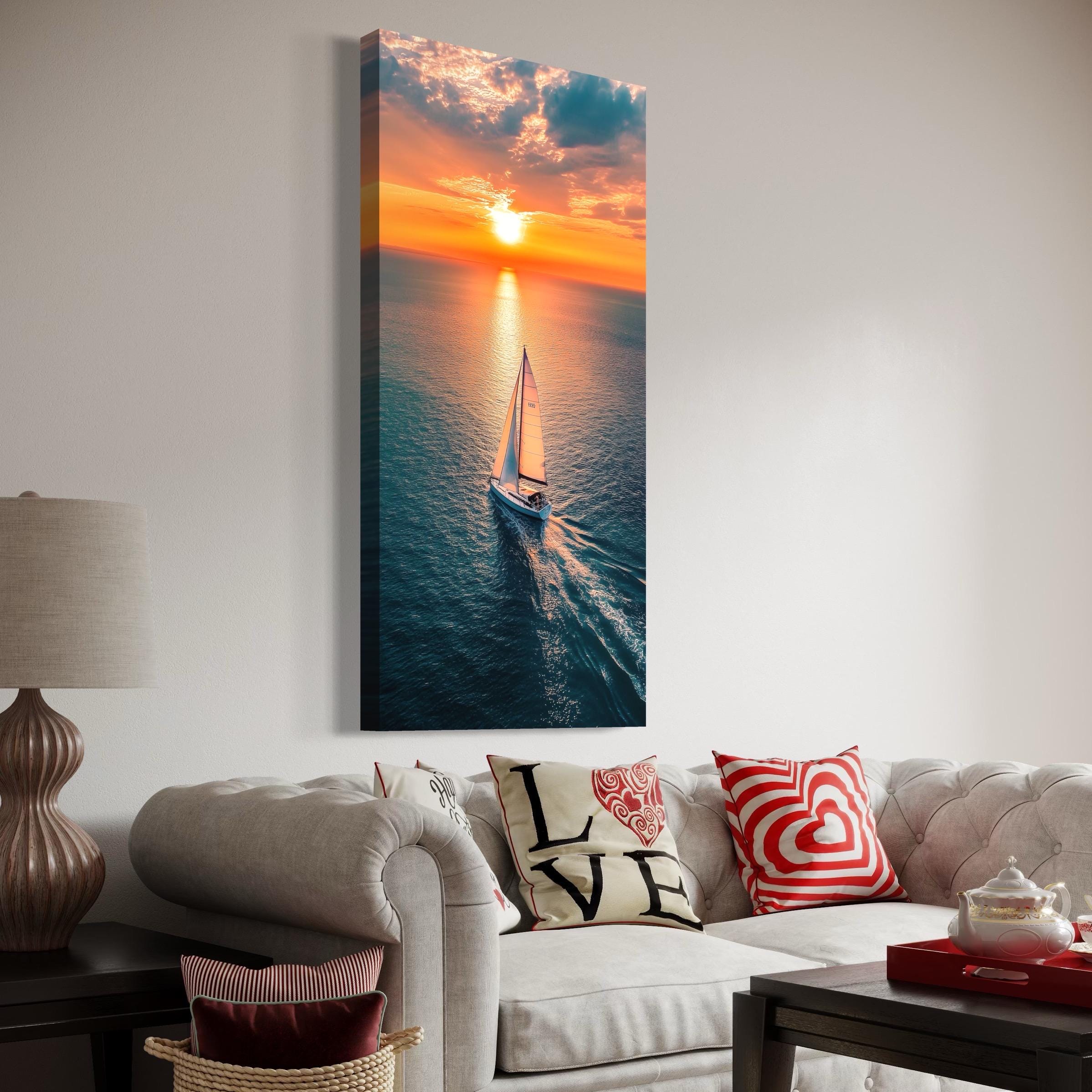 Lone sailboat on ocean water at sunset with bright sun, clouds, and golden reflections