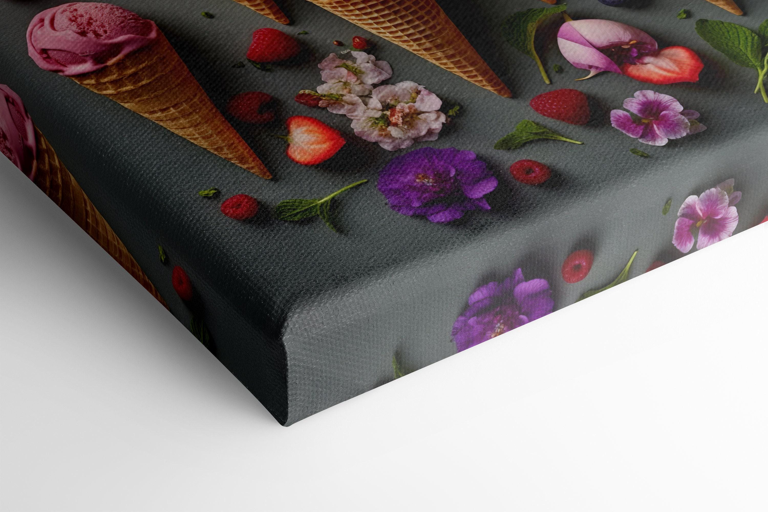 A colourful arrangement of ice-cream cones, scoops and berries sits on a dark grey background, surrounded by scattered flowers and mint leaves detail