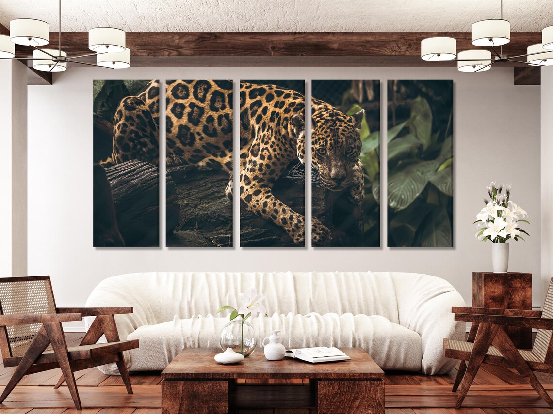 Room mockup with a dark green jungle jaguar artwork on a wall above a wooden sideboard
