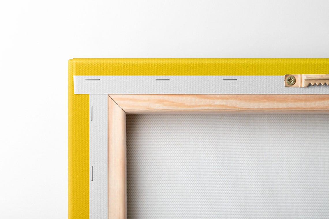 Mustard yellow artwork with four black paw prints arranged in a symmetrical pattern detail view