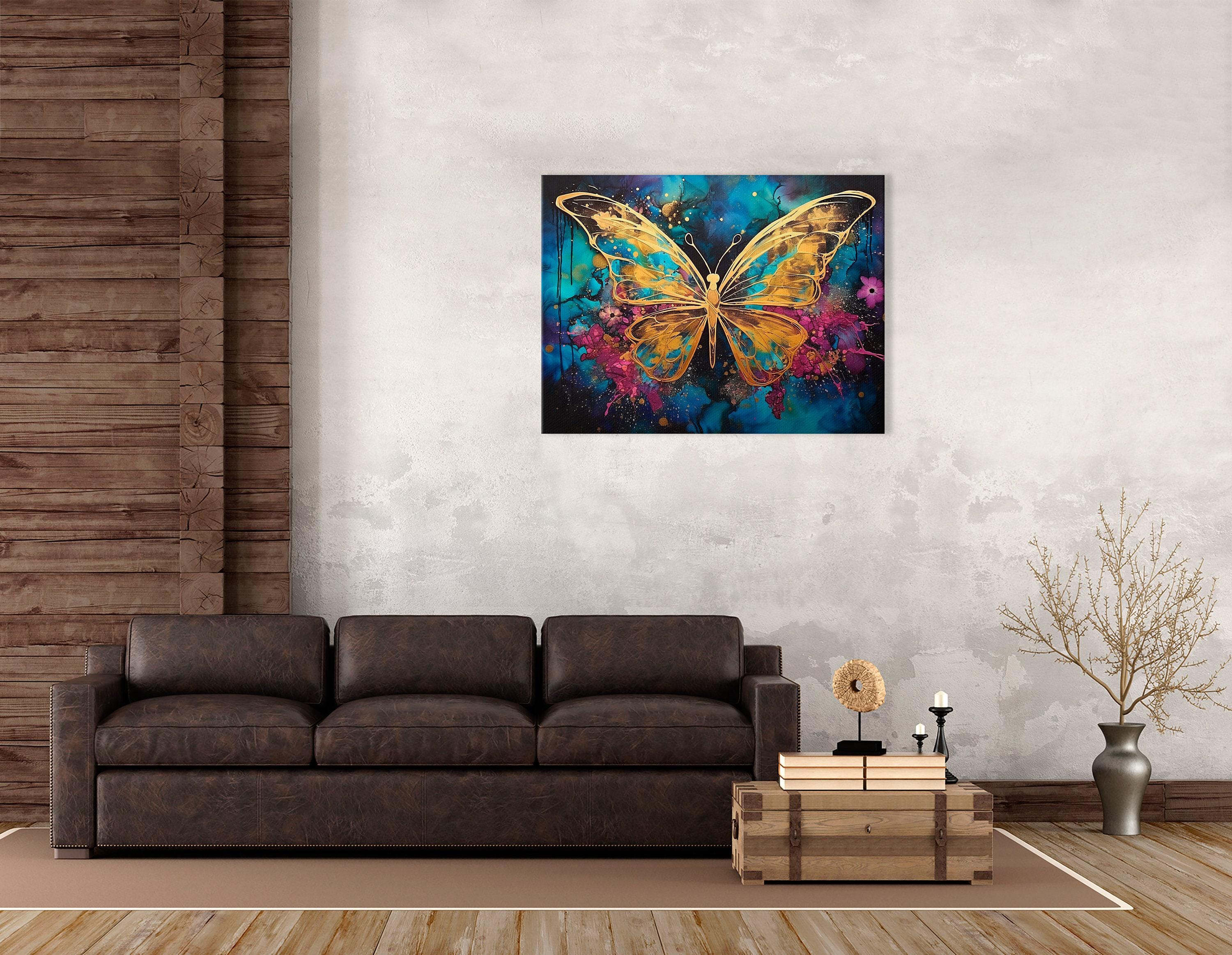 Abstract gold butterfly on a teal, blue and magenta splash background with glitter-like speckles detail view