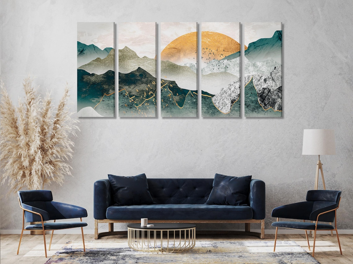 Abstract three-panel mountain landscape with teal slopes, warm gold sky and misty clouds detail view