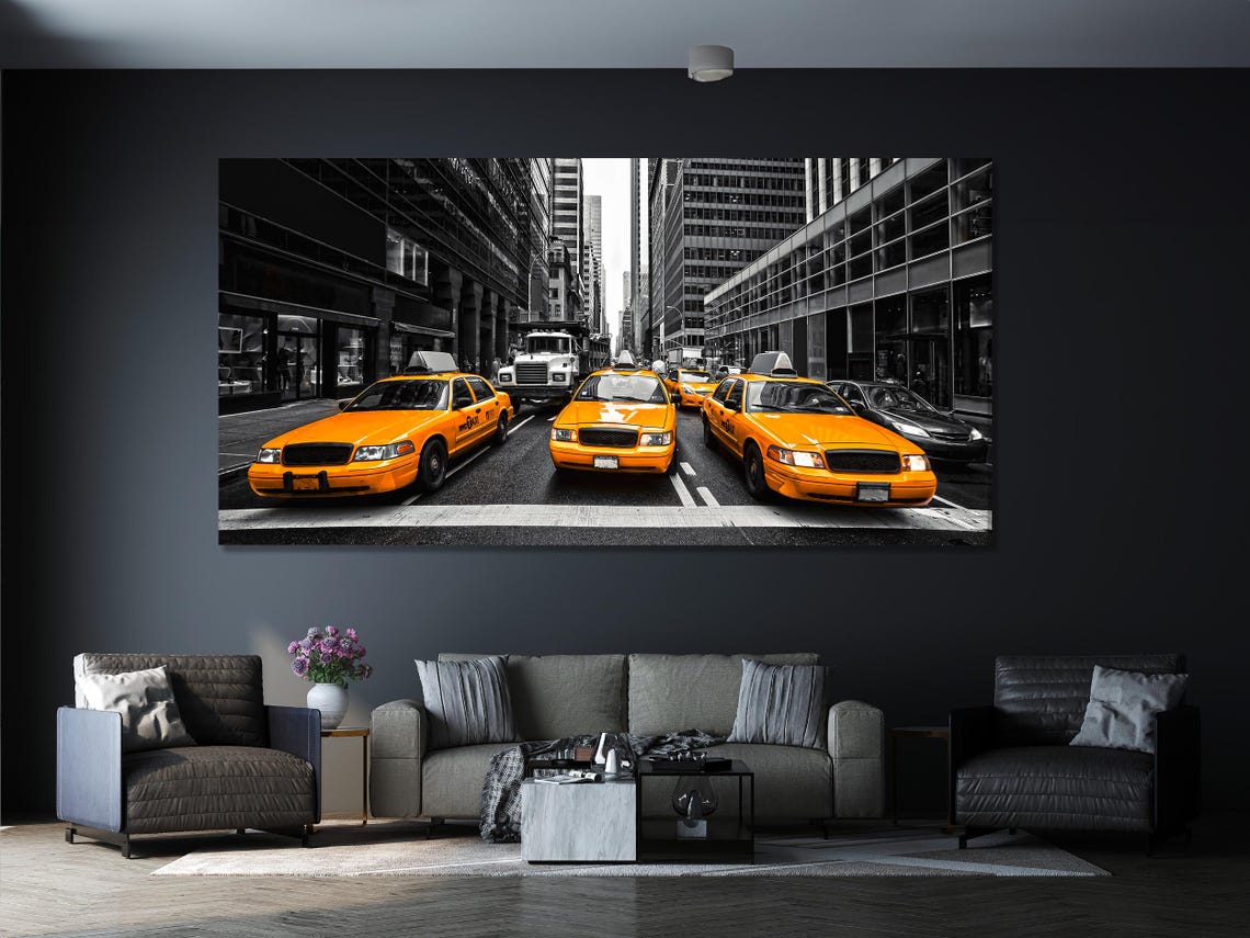 Room mockup with three-panel yellow taxi street artwork above a sofa