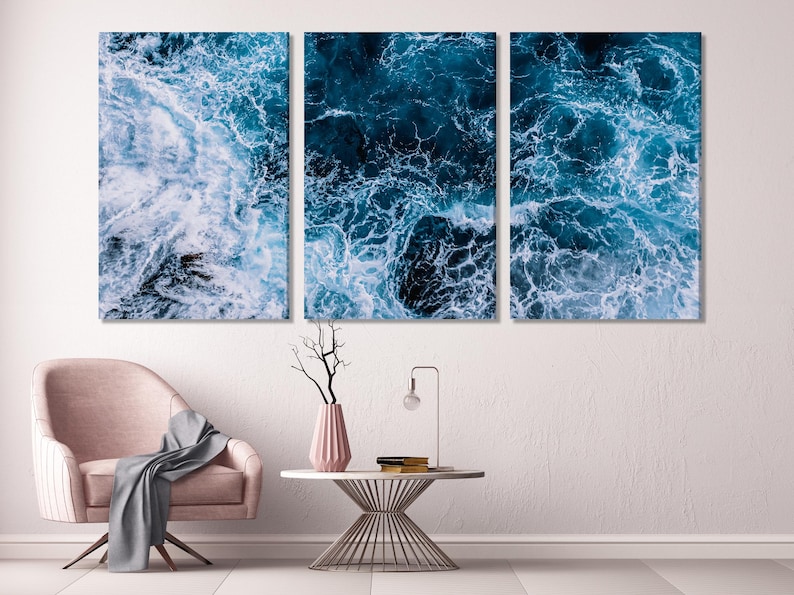 Close-up ocean waves with white foam and deep blue water across three panels