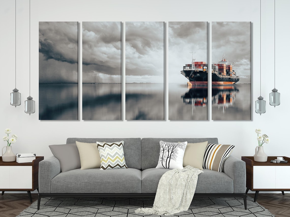 Modern room mockup featuring a cargo ship seascape artwork above a sofa
