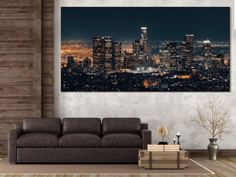 Night city skyline with illuminated buildings under a deep navy sky