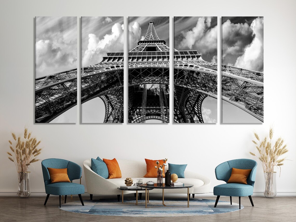 Room mockup with a large black-and-white Eiffel Tower artwork above a sofa