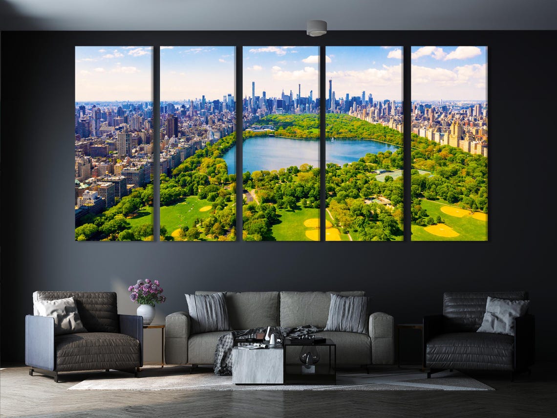 Kitchen mockup with three framed aerial cityscape panels above a dining table