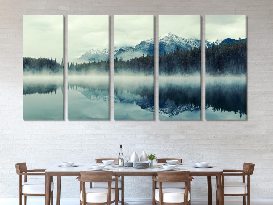 Room mockup showing a misty mountain lake artwork above a sofa