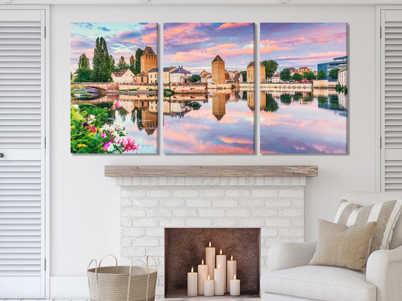 A three-panel sunset cityscape shows historic stone towers and buildings reflected in a calm river, with a pink-orange sky and green trees