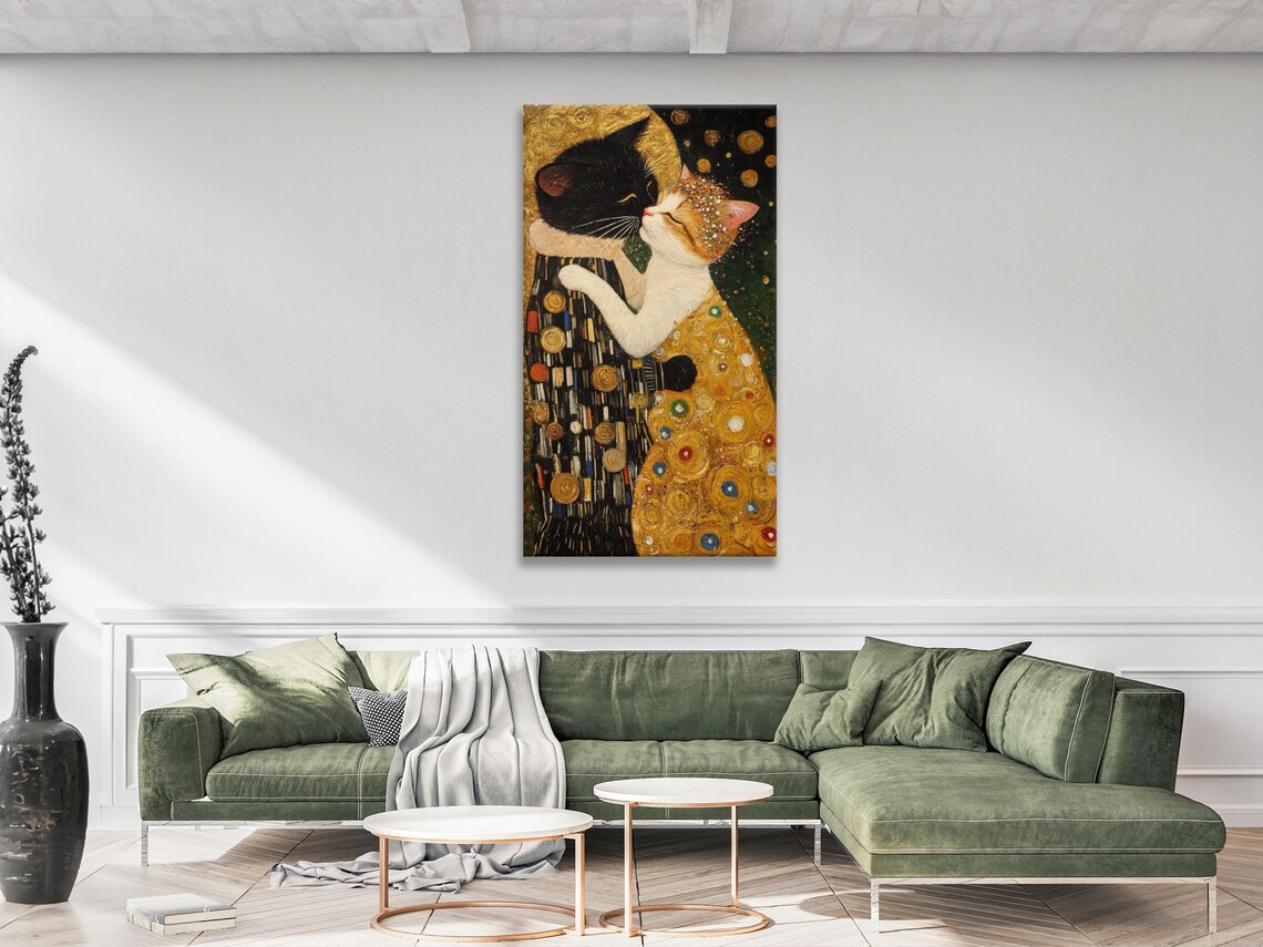 Cat kiss artwork hanging on a wall in a bright room with white chairs and a table