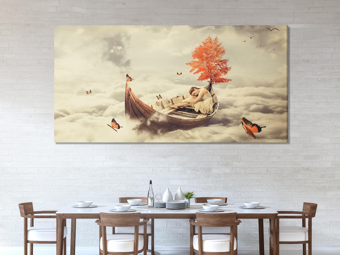 Living room mockup with a dining table and chairs and a set of surreal cloud artworks on the wall