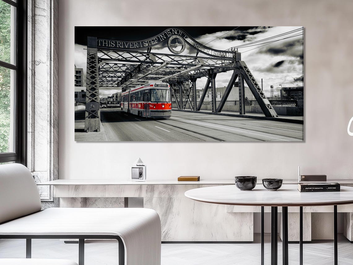 Mockup showing two chairs and a wall with three-panel bridge artwork above a console table