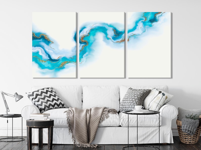 Three-panel abstract artwork with turquoise and sky-blue waves and thin gold lines