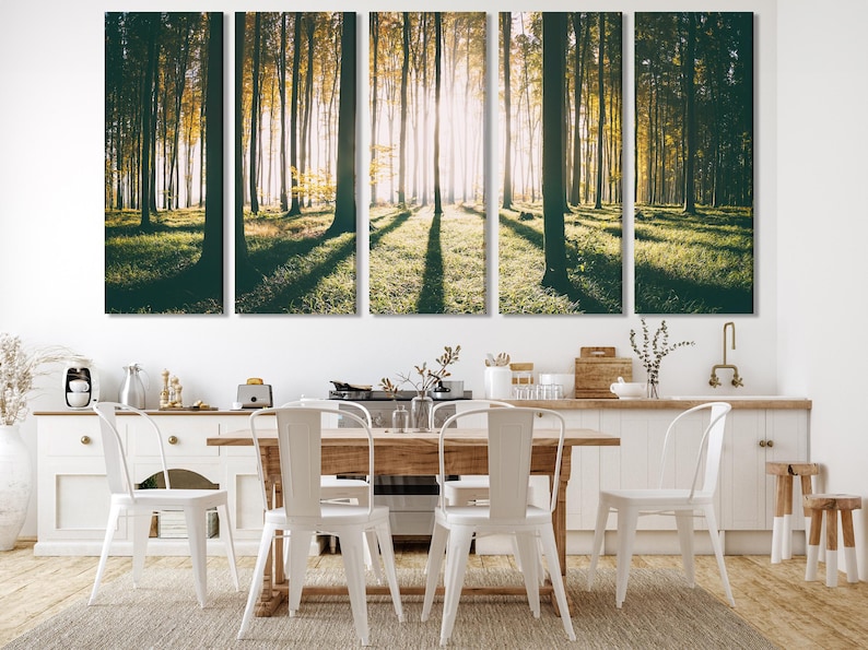 Sunlit forest artwork with tall trees, misty light beams, and deep green shadows