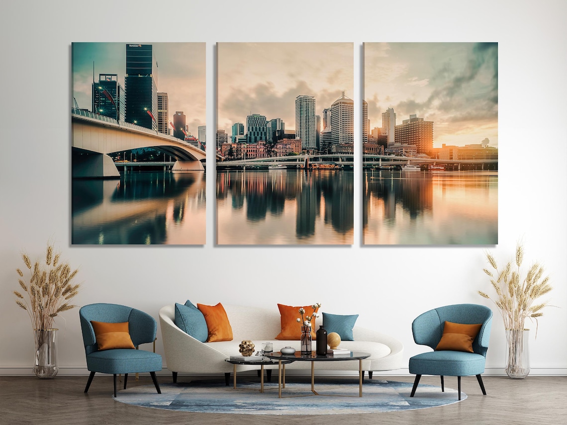 City skyline artwork above a green sofa in a bright living room