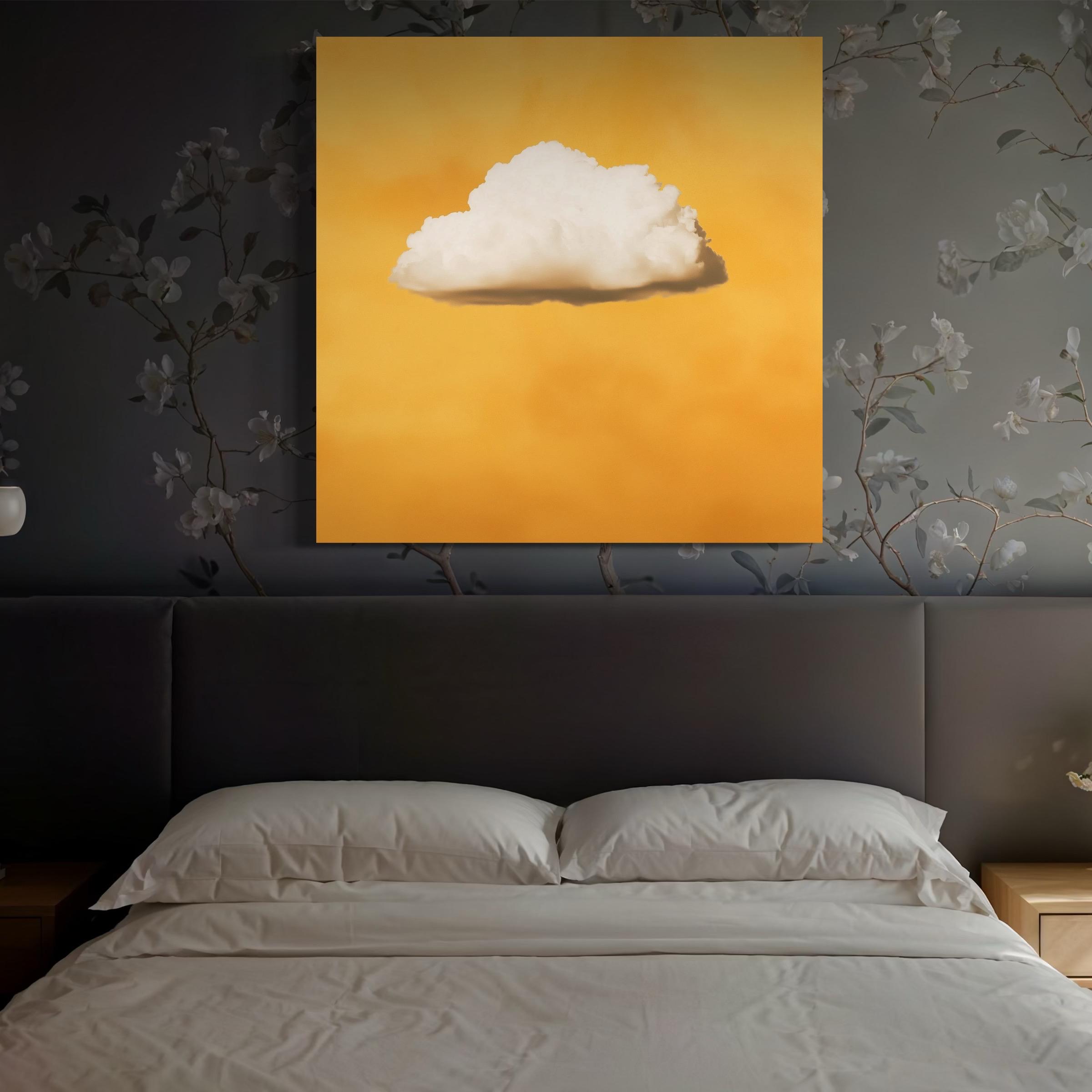 White cloud artwork hanging above a sofa with pillows in a bright room
