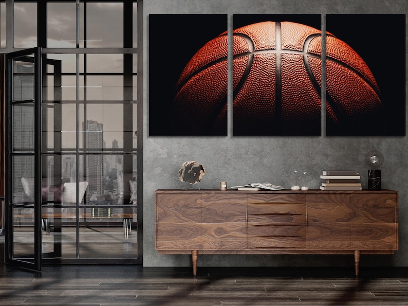 A macro basketball close-up is split across three panels, showing textured orange ball surfaces with bold black shadows and pale curved seam lines