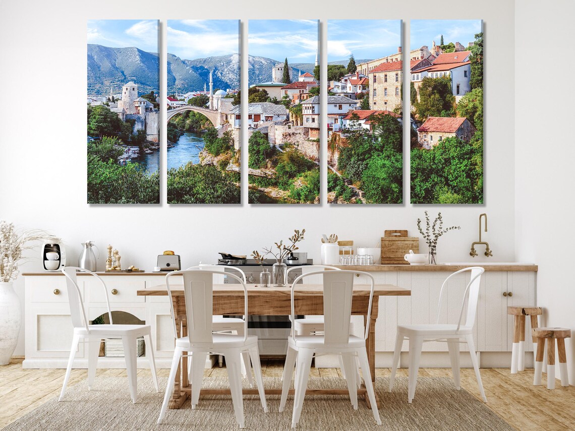 Room mockup with three-panel scenic bridge artwork above a sofa