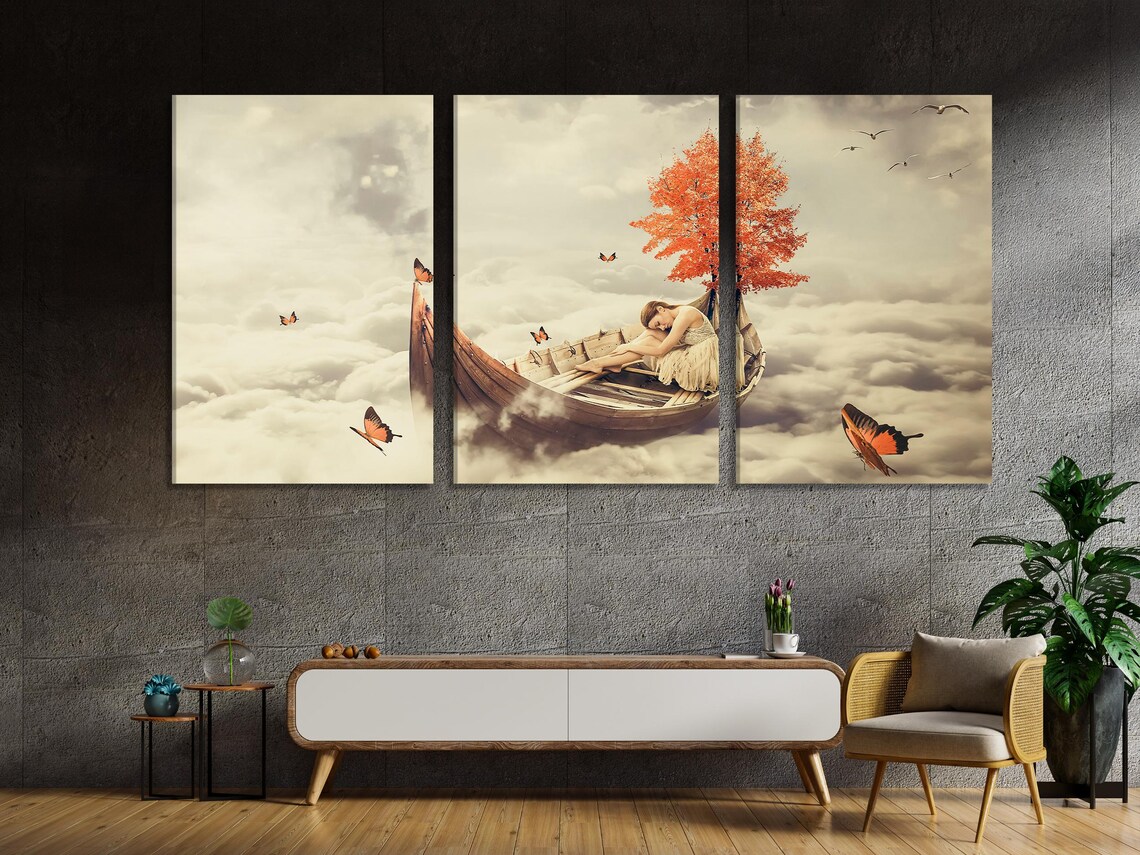 Living room mockup with a dining table and chairs and a set of surreal cloud artworks on the wall