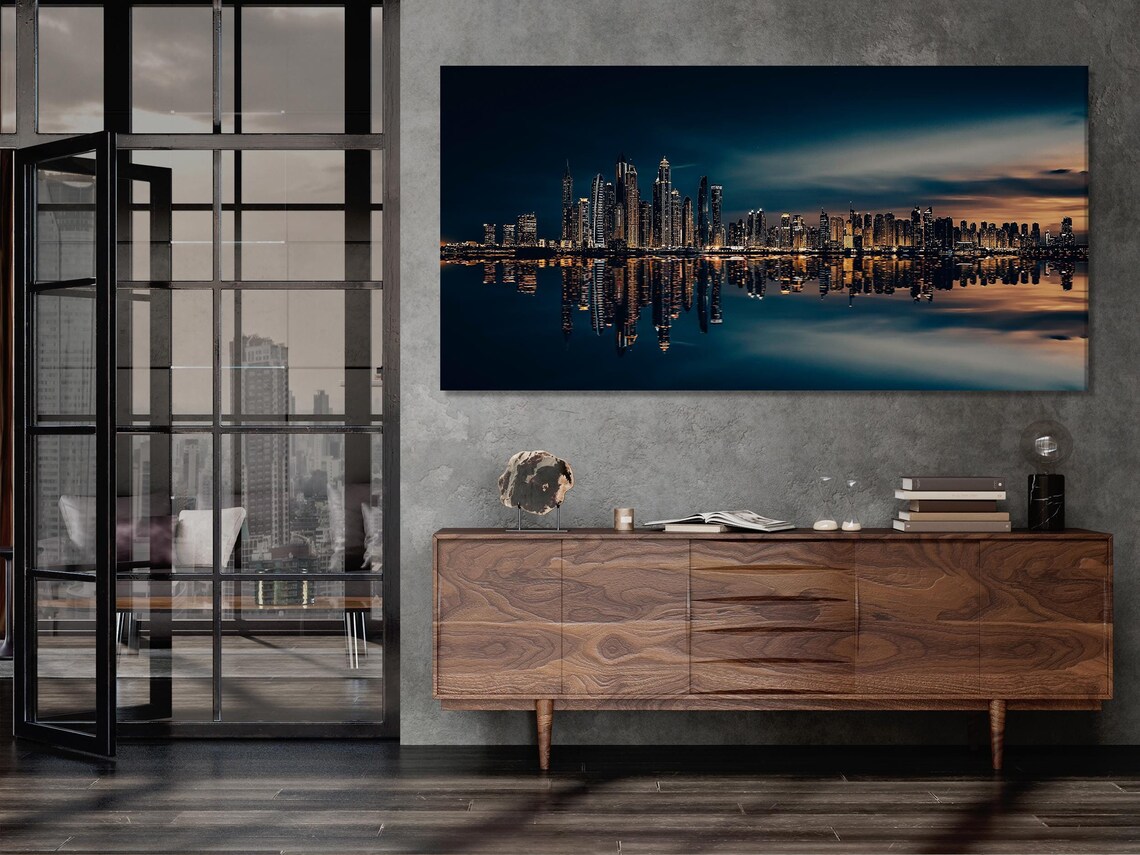 Five-panel night city skyline with illuminated skyscrapers and reflected lights on water detail view