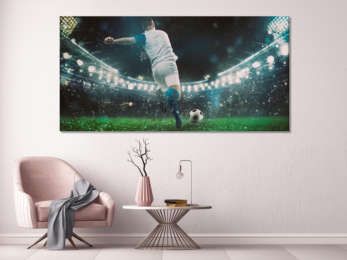 Room mockup showing three football action wall artworks above a sofa
