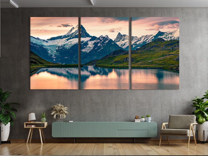 Mountain lake landscape with snowy peaks and sunrise sky in blue and blush pink