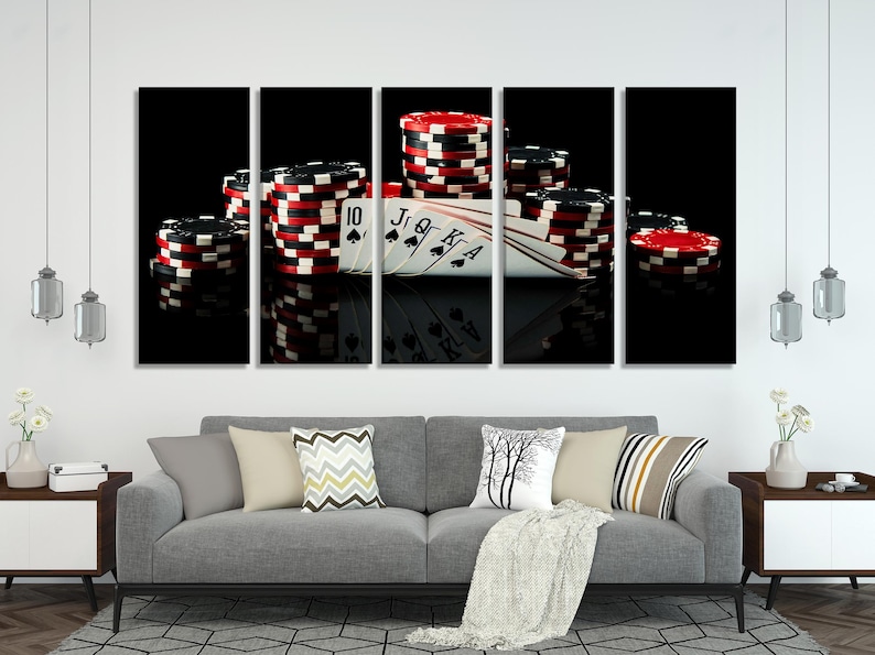 Poker cards and stacked red-and-white chips on a dark reflective casino background