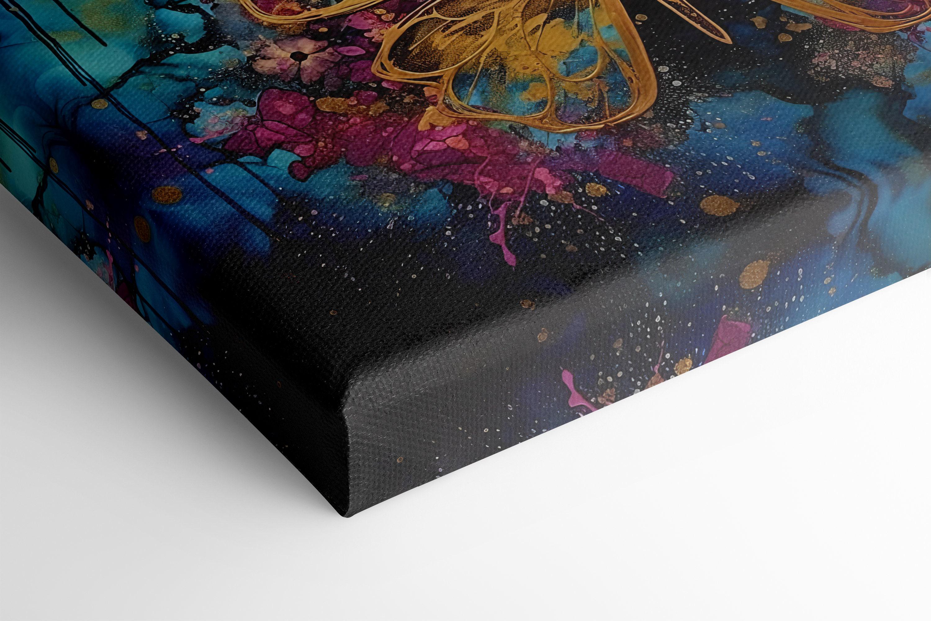 Abstract gold butterfly on a teal, blue and magenta splash background with glitter-like speckles detail view