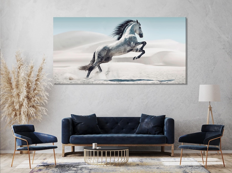 Rearing galloping horse above pale desert dunes under a bright sky
