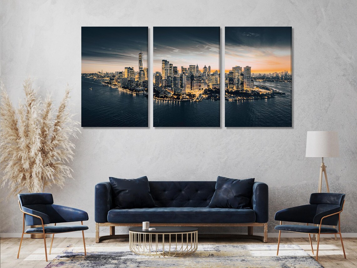 Room mockup showing a Manhattan skyline at dusk artwork above a sofa