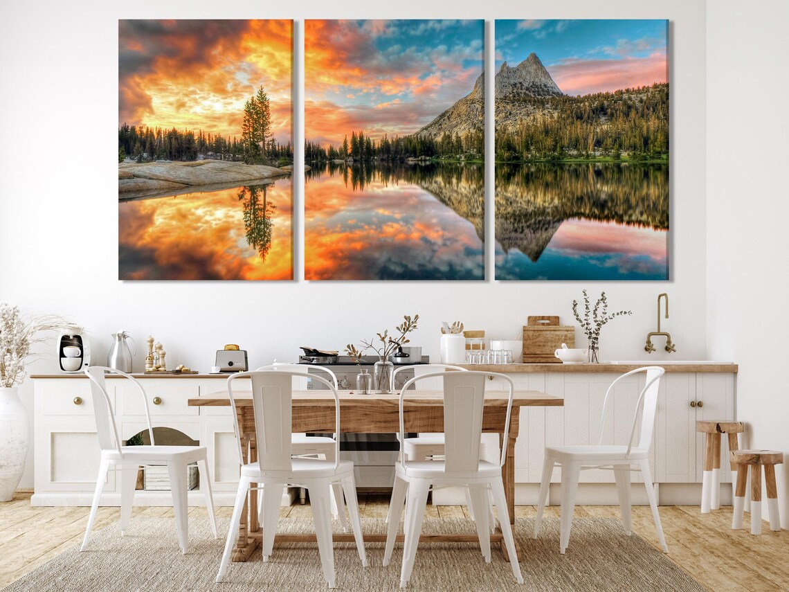 Living room with five framed landscape panels above a sofa