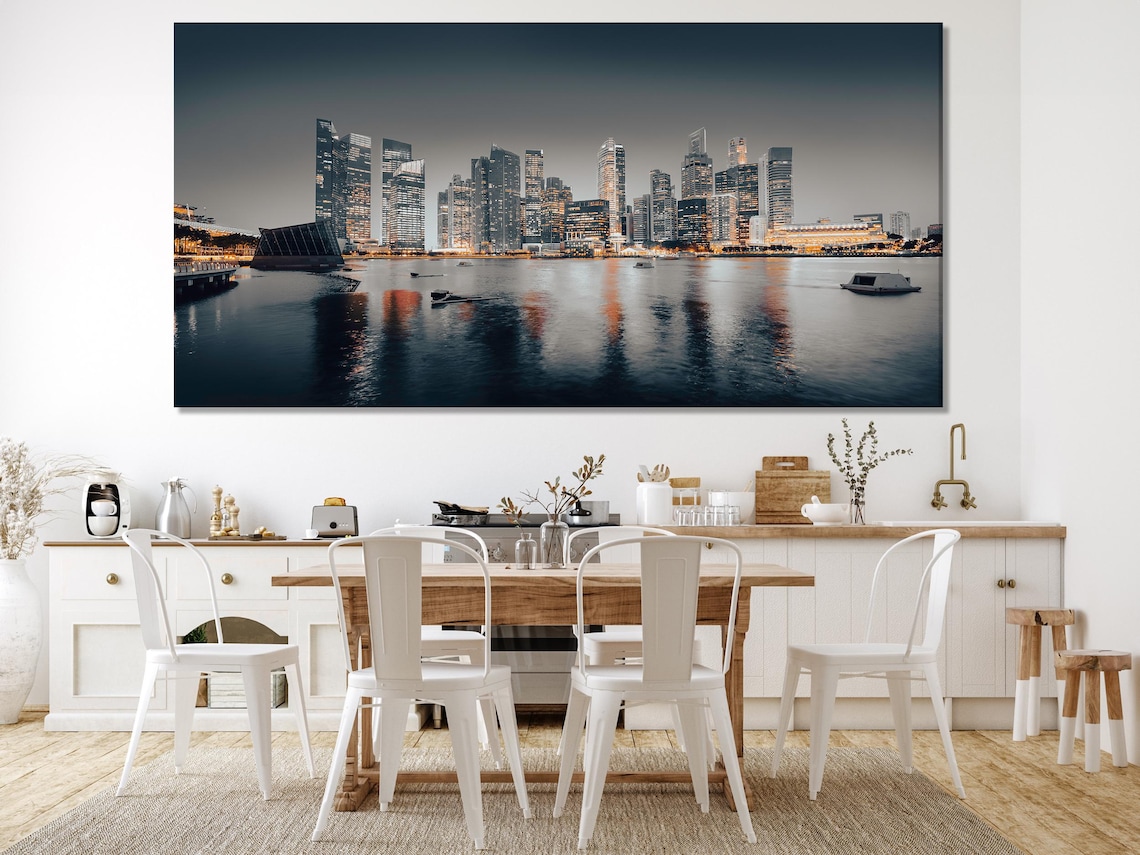 Living room mockup showing five-panel night city skyline artwork above a sofa
