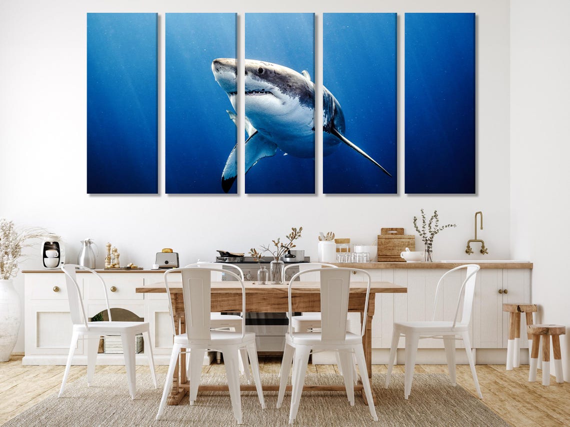 Realistic great white shark swimming through deep blue underwater water detail view