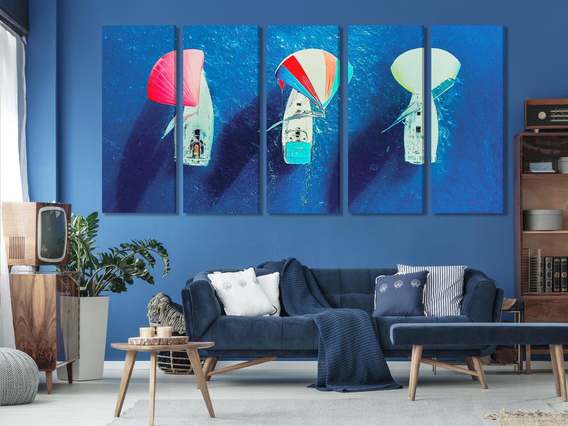 Aerial triptych of sailboats on deep blue ocean with bright red and pale green spinnaker sails detail view