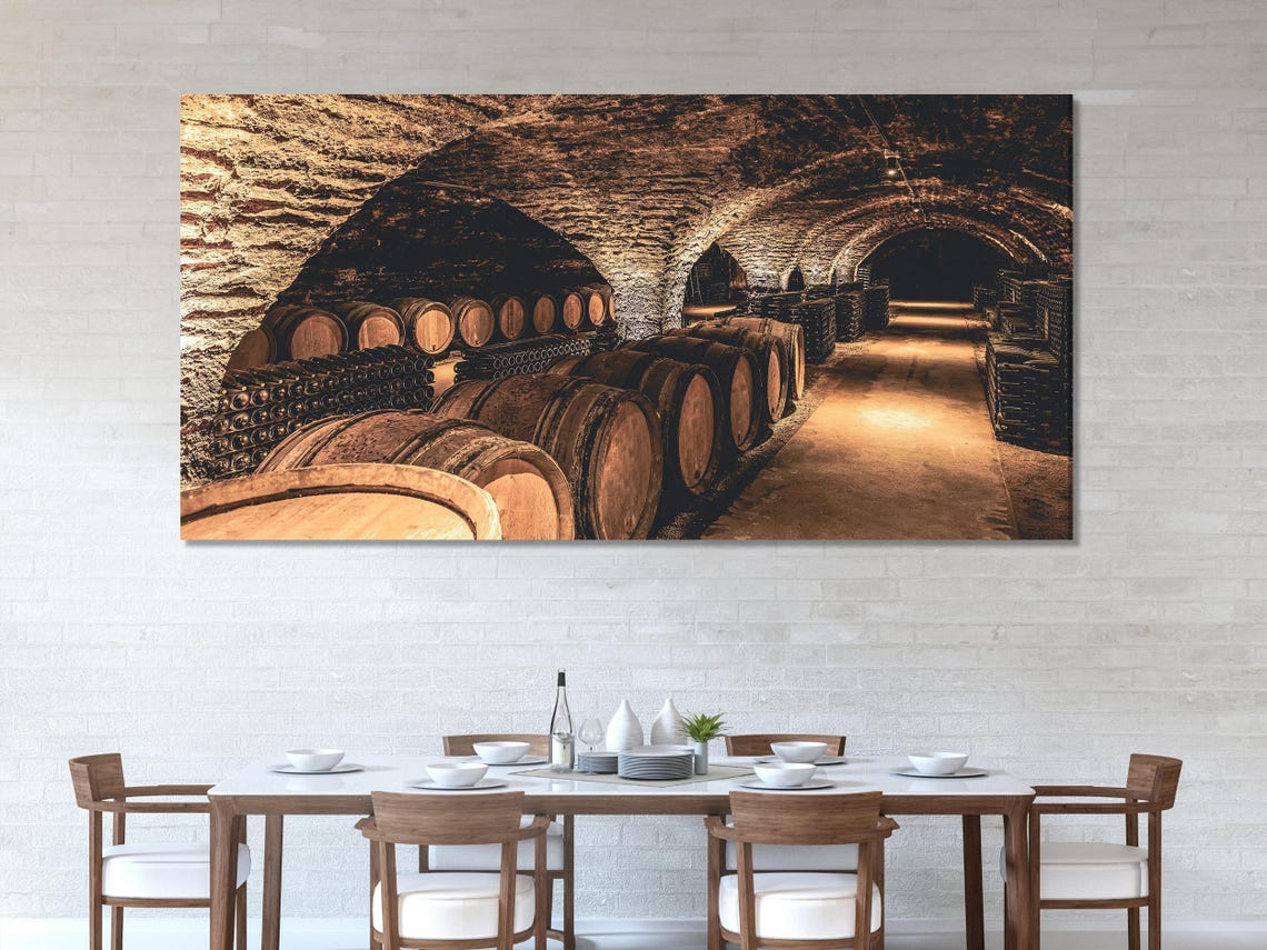 Room mockup showing three-panel wine cellar artwork above a sofa and table