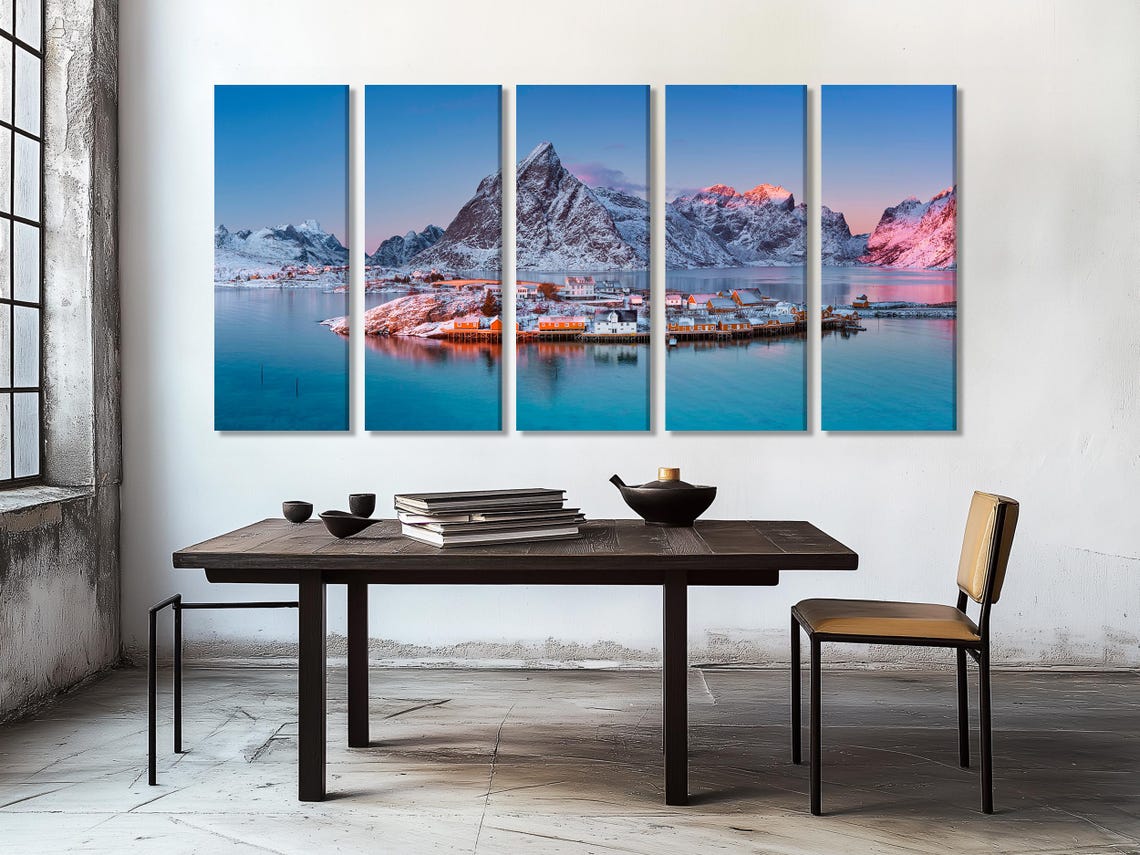 Triptych winter coastal artwork above a sofa in a modern room mockup