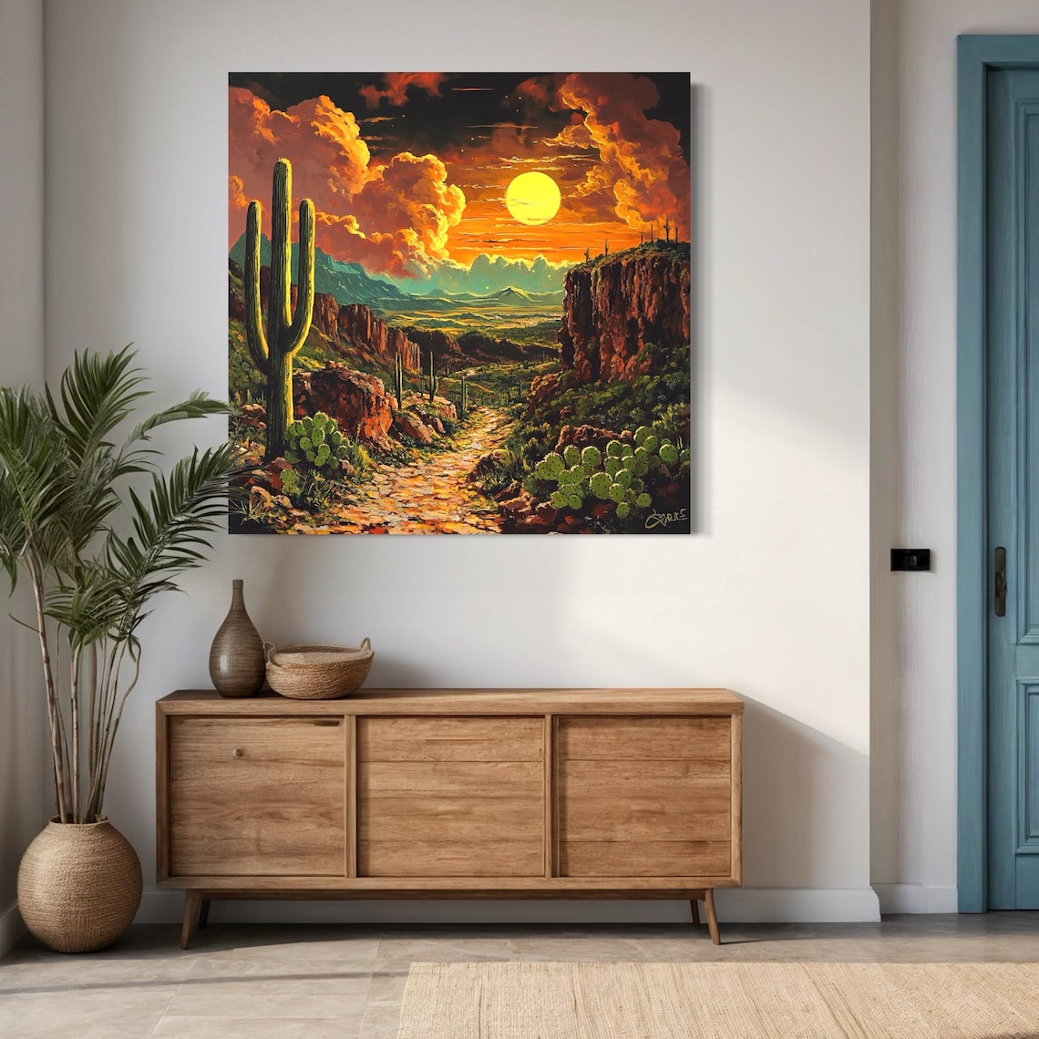 Desert sunset landscape wall art above a bed in a bright room
