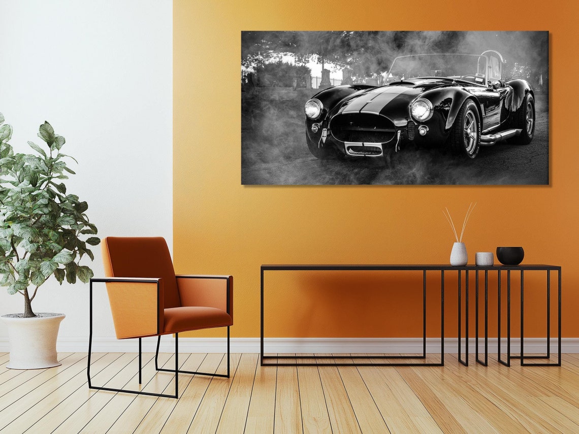 Black-and-white classic sports car across three vertical panels with misty outdoor background and bright headlights detail view